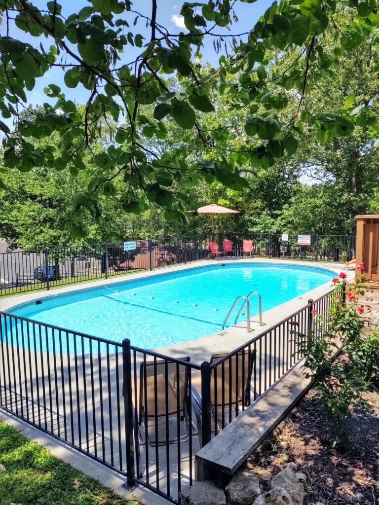 peaceful pool with crystal clear water at Unhitched Branson RV Park in Branson, Missouri