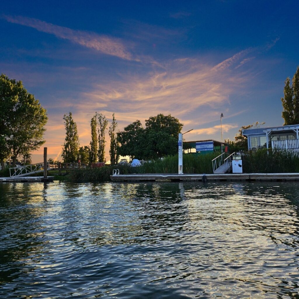 sunset over the island at Snug Harbor Marina along the Sacramento River Delta