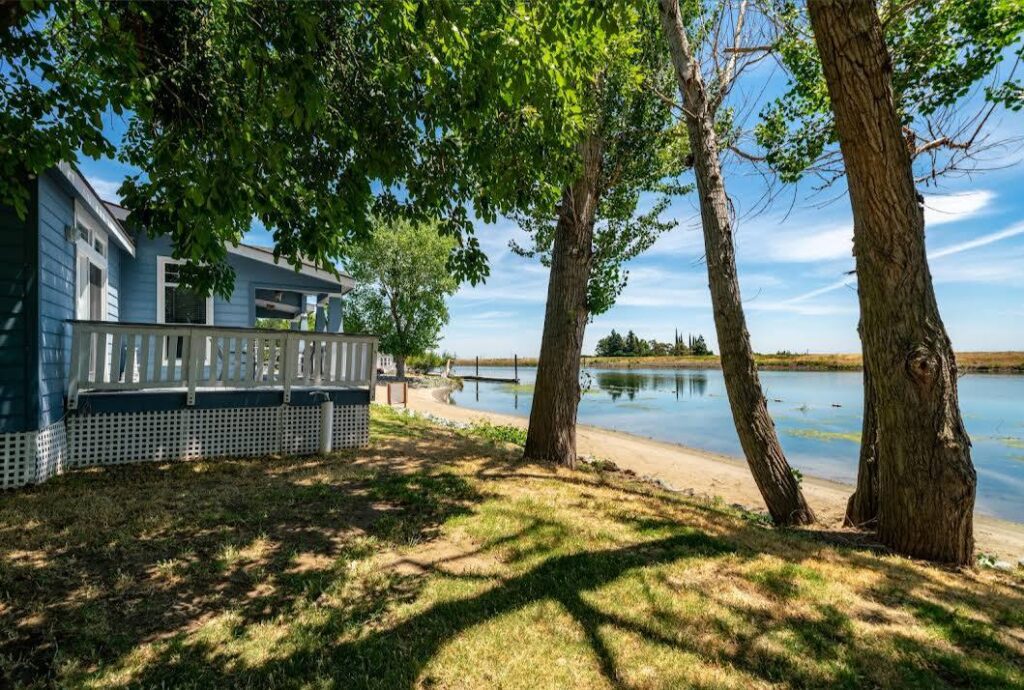 beach view overlooking the Snug Harbor marina along the Sacramento River Delta