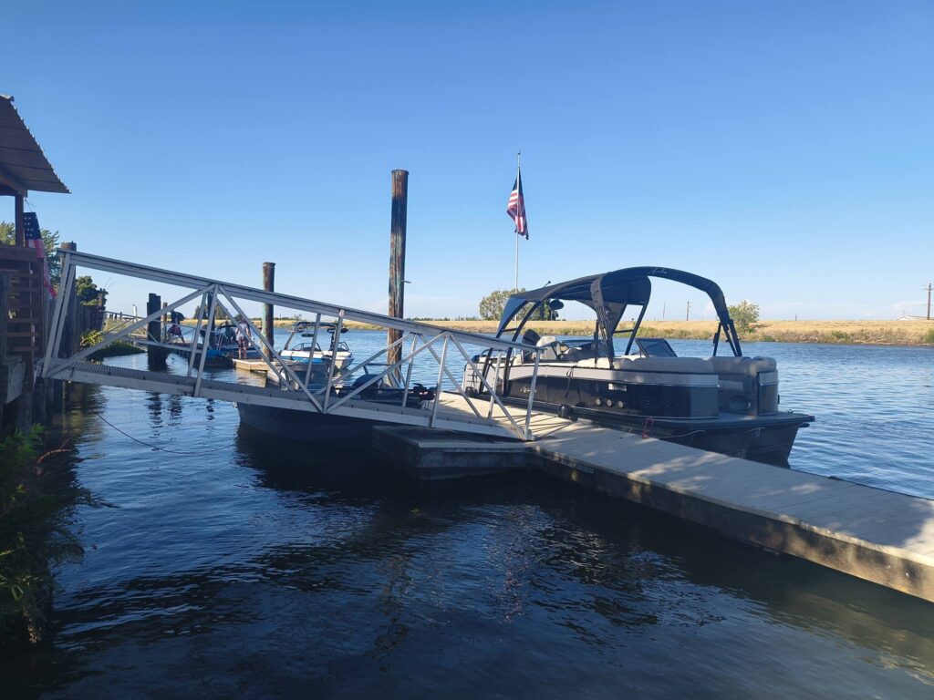Boat dock and marina access to the Sacramento River Delta at Snug Harbor Marina